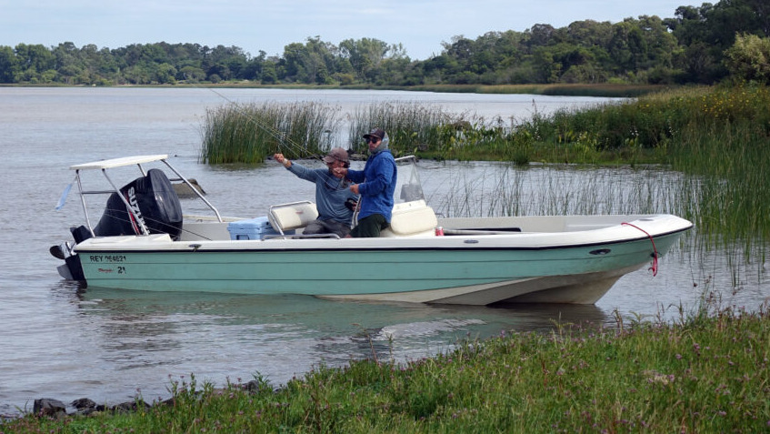 Two men fishing from boat